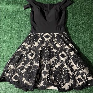 Chic Black and Cream Off-Shoulder Dress